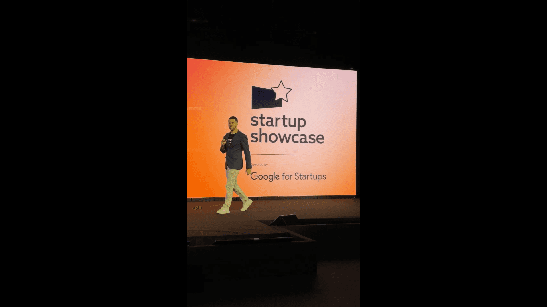 Vitor Pio presents TroqPay at the Google for Startups-supported Startup Showcase during Web Summit Rio 2026.